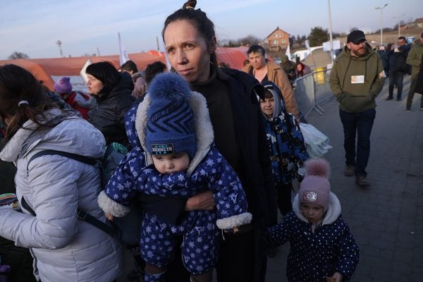 Photograph: A mother arrives with her children in Poland from war-torn Ukraine at the Medyka border crossing on March 15, 2022 in Medyka, Poland.

Source: Sean Gallup/Getty