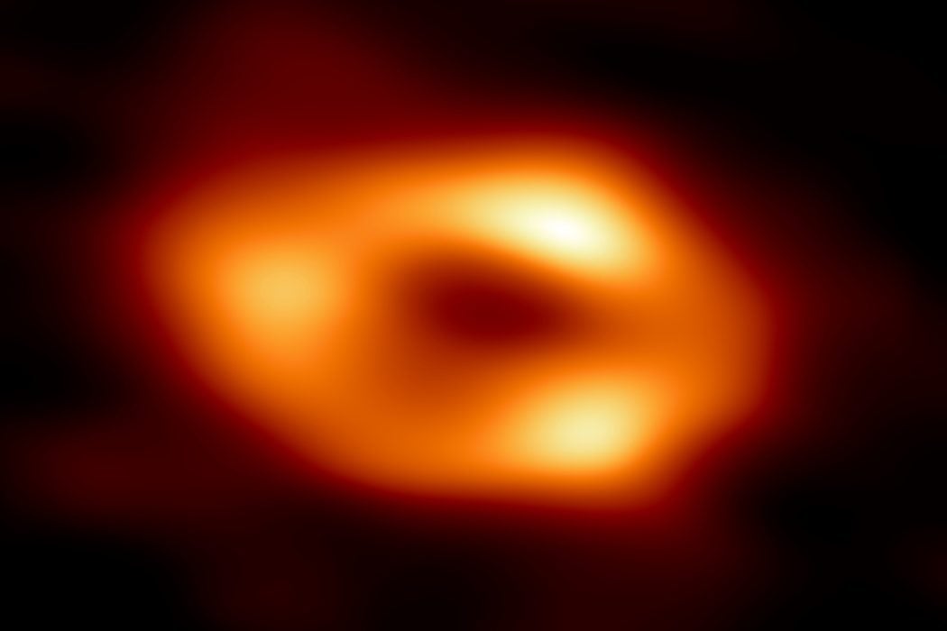 Glowing ring of gas around central dark shadow of black hole Sagittarius A* at center of Milky Way