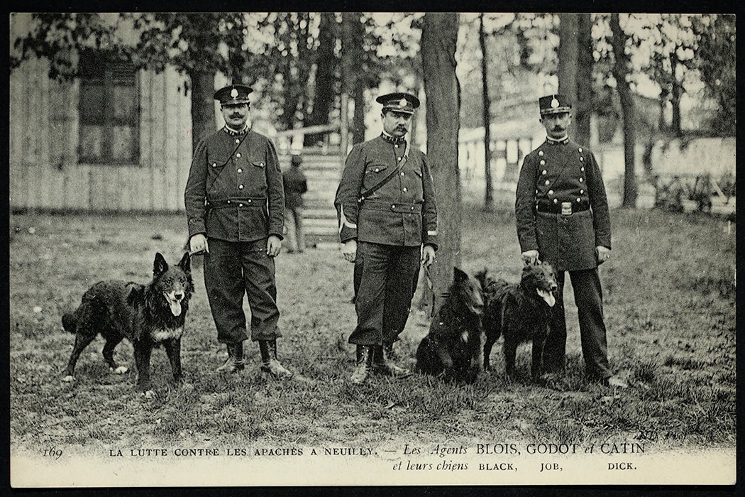 Officers Blois, Godot and Catin and their dogs, Black, Job and Dick, in Neuilly-sur-Siene, 1900