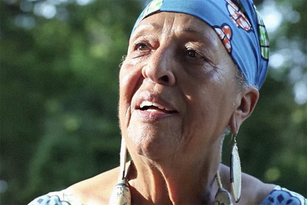 A screenshot from a video of a woman speaking Gullah and English