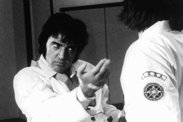 Elvis Presley is shown during a karate workout, as seen in the film 'This Is Elvis', 1981.