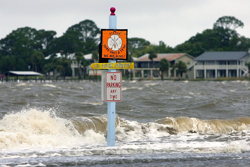 A no parking sign stands in the increased surf brought in by Tropical Storm Alberto June 13, 2006 in Cedar Key, Florida.