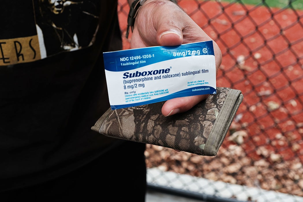 A heroin user holds suboxone near where John Jay College of Criminal Justice students are interviewing heroin users as part of a project to interview Bronx drug users in order to compile data about overdoses on August 8, 2017 in New York City.