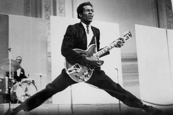 Chuck Berry does the splits as he plays his Gibson hollowbody electric guitar in circa 1968.