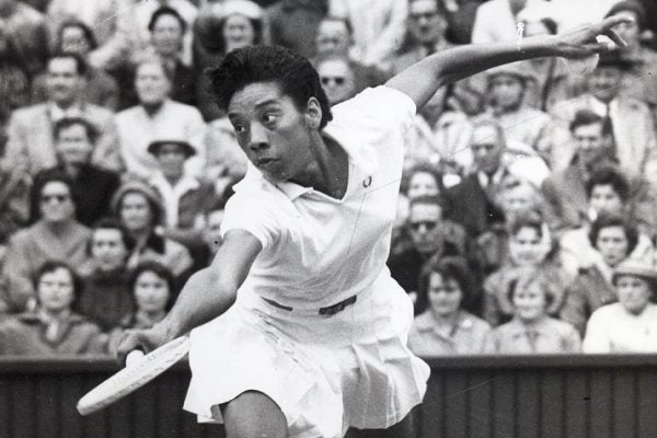 Althea Gibson of the United States plays during Wimbledon in 1956
