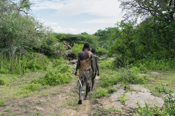 Hadzabe men going for hunt in a morning at the bush