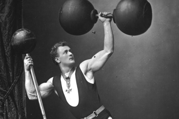 Photograph: German strongman Eugene Sandow lifting weights and dumbbells, c. 1890