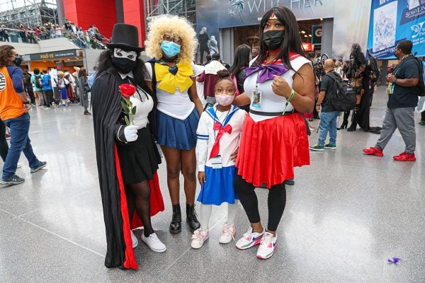 Cosplayers dressed as characters from Sailor Moon pose during Day 4 of New York Comic Con 2021 at Jacob Javits Center on October 10, 2021 in New York City.