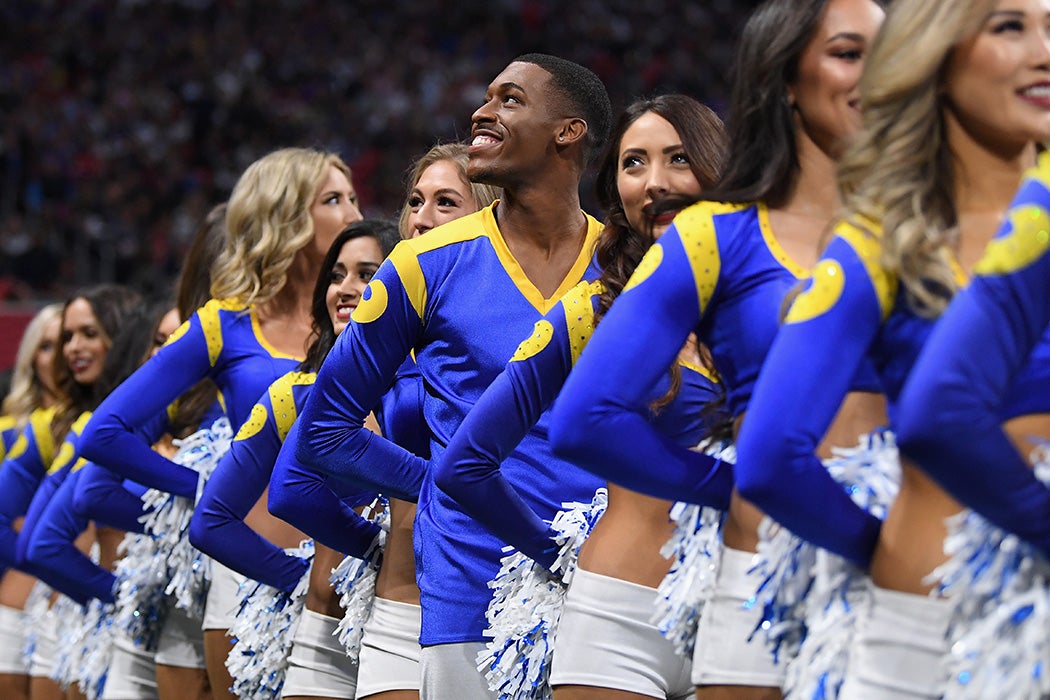 Los Angeles Rams cheerleader Quinton Peron looks on during Super Bowl LIII against the New England Patriots at Mercedes-Benz Stadium on February 3, 2019 in Atlanta, Georgia.