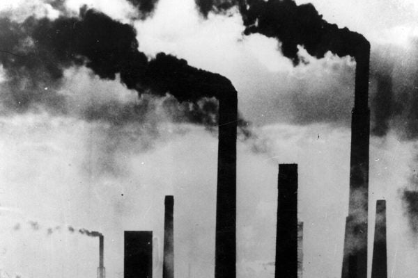 Factory chimneys pumping out pollution in the Ruhr, Germany, 1970