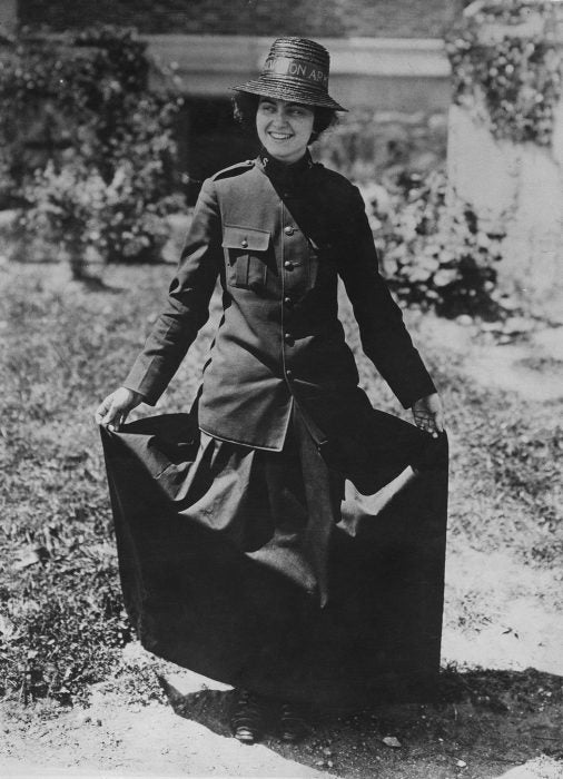 A young Salvation Army member shows off her uniform, circa 1920. 