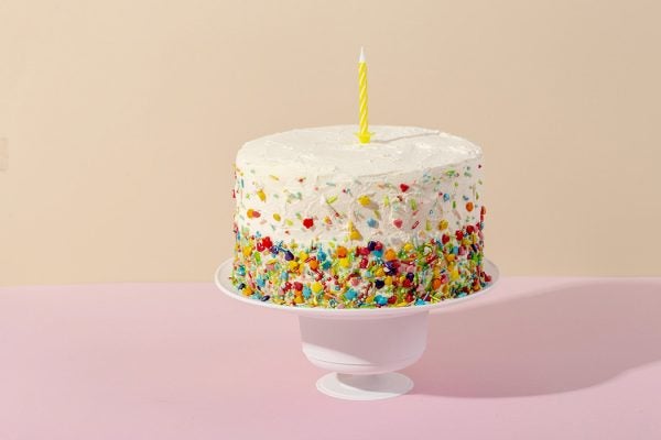 A birthday cake on a pastel background
