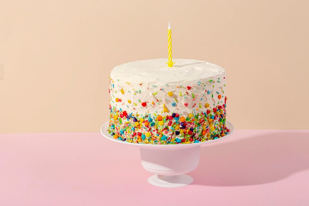 A birthday cake on a pastel background