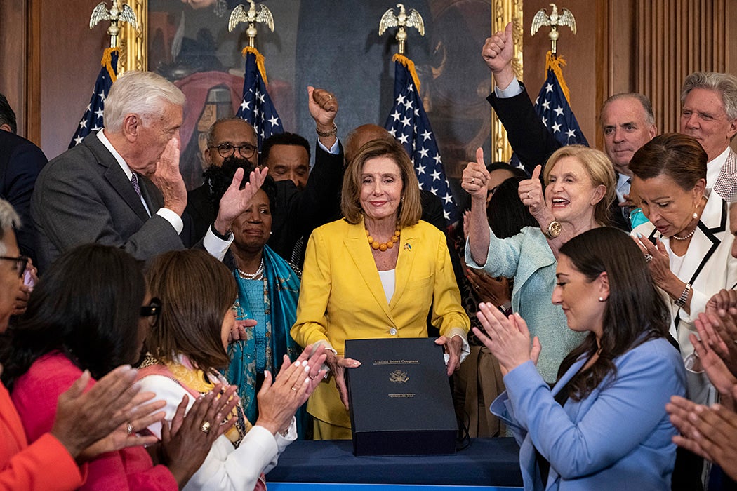 House Democrats applaud after Speaker of the House Nancy Pelosi signed the Inflation Reduction Act, August 12, 2022
