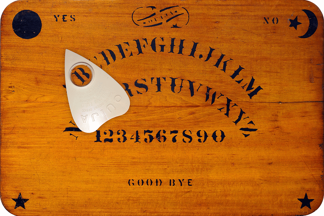 A ouija board and a planchette
