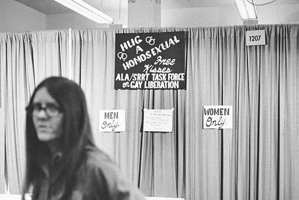 Sign for the "Hug a Homosexual" booth run by the Task Force on Gay Liberation at the 1971 Annual Conference in Dallas.