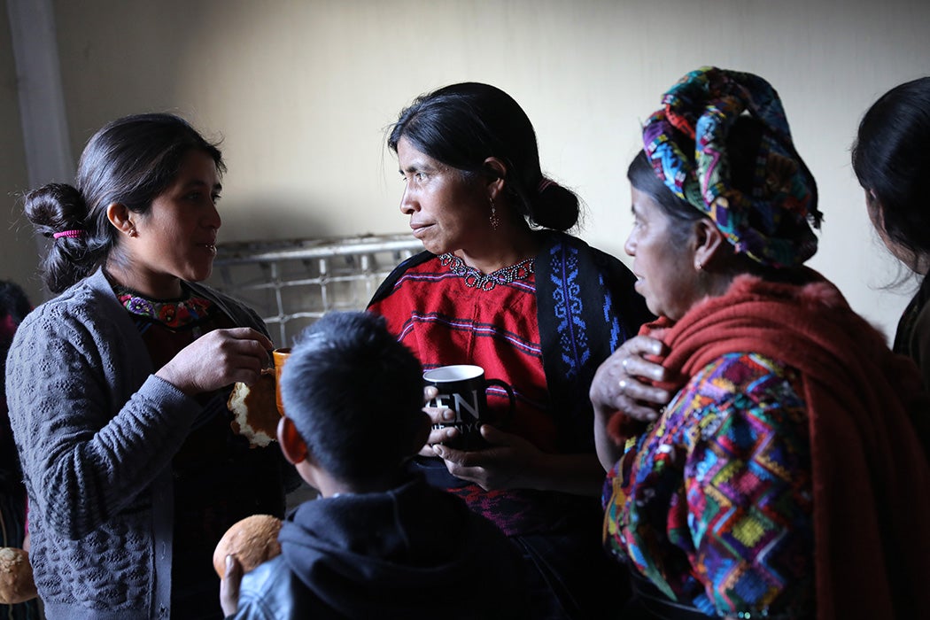 Mam-speaking women drink coffee after a group meeting on February 12, 2017 in Cajola, Guatemala
