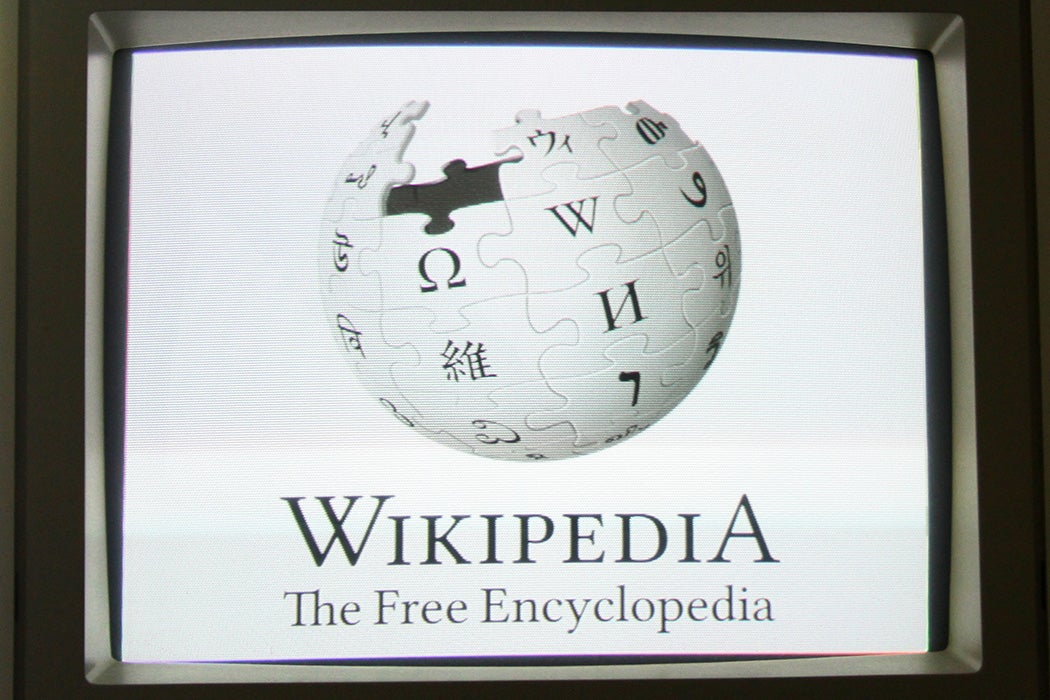 A computer screen with an old Wikipedia logo