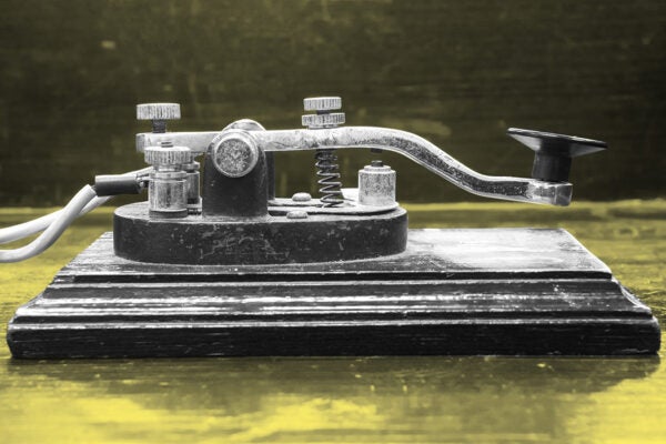 old morse key telegraph on wood table