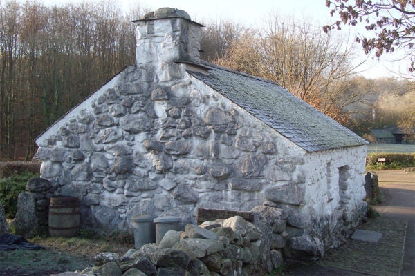 Llainfadyn cottage. This 1762 cottage is solidly-built of mountain boulders, and a pair of stout oak trusses supports the roof of small, locally-quarried slates.