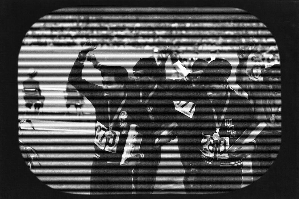 Tommie Smith, John Carlos and other members of US team give the Black power salute at the 1968 Mexico City Olympics