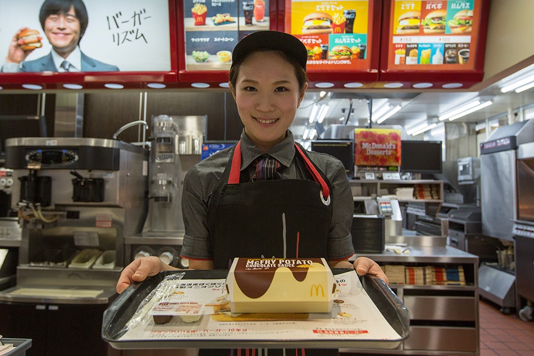 McDonald's Japan Swing Manager Miwa Suzuki presents a box of McChoco Potato on January 25, 2016 in Tokyo, Japan