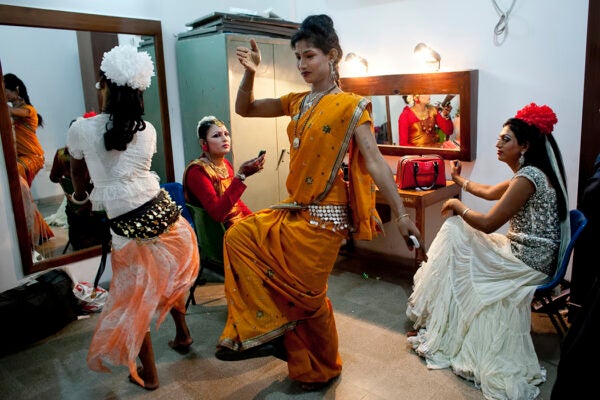 Hijras (transgender) dance as they get ready backstage before the Hijra talent show, part of the first ever event called Hijra Pride 2014, on November 10, 2014 in Dhaka, Bangladesh.