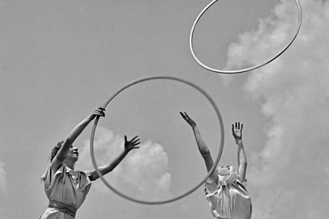 Two women throwing hoops circa 1960