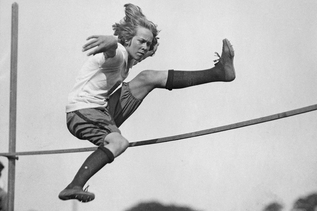 American athlete Nancy Voorhees clears the bar as she trains for the high jump event ahead of the 1922 Women's World Games, during a training session at Weequanic Park in Newark, New Jersey, 1922