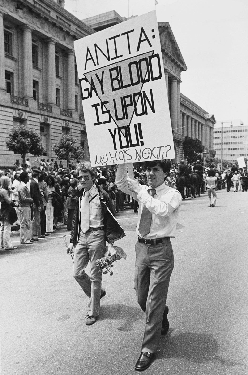 An activist carries a placard which reads 'Anita: Gay Blood Is Upon You! Who's Next?' during the fifth 'Gay Freedom Day' (San Francisco Pride) during which many protesters ridiculed singer Anita Bryant and her anti gay crusade, San Francisco, California, US, 26th June 1977.