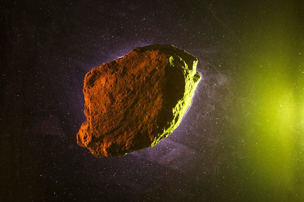 Asteroid rock on green starry background
