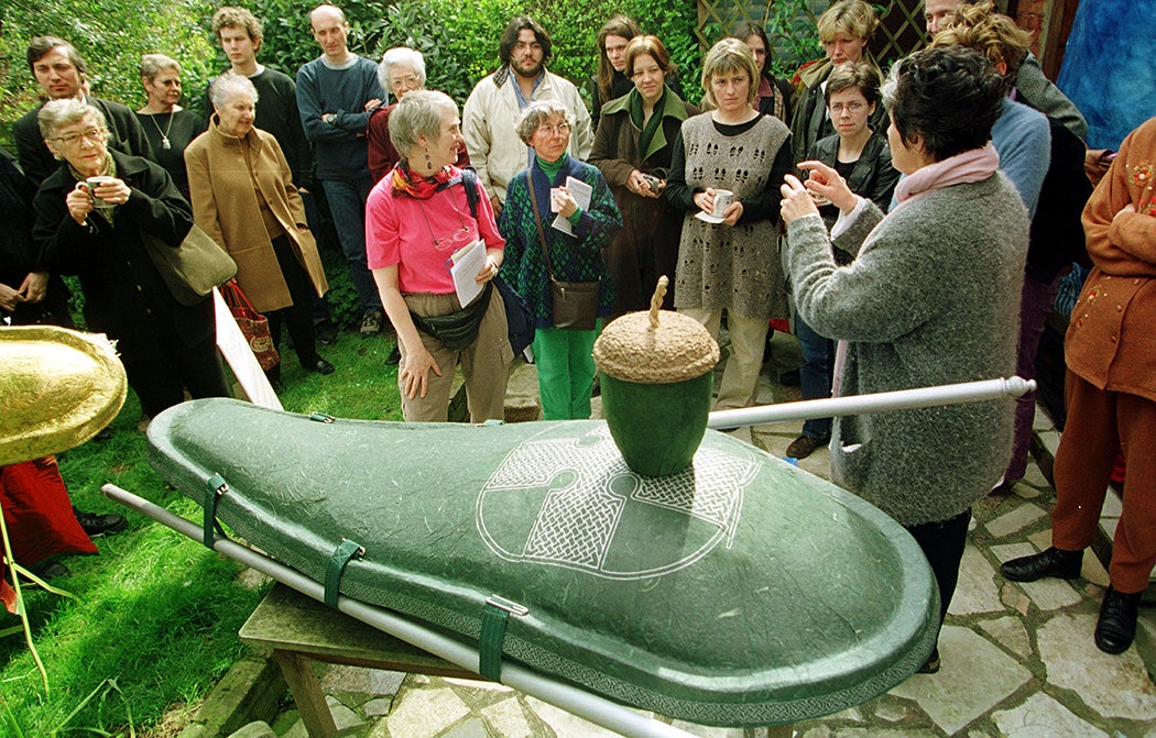 Designer Hazel Selina displays her ''Ecopod'' environmentally friendly coffin, and an ''acorn'' papier mache urn for cremation ashes April 8, 2001 as part of the ''Day for the Dead'' event at The Natural Death Centre in Cricklewood, North London.
