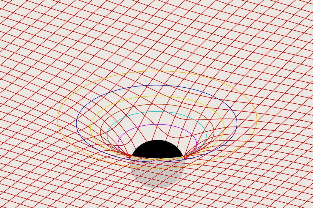 Spacetime as represented by a grid with a body (presumably a black hole) bending it.