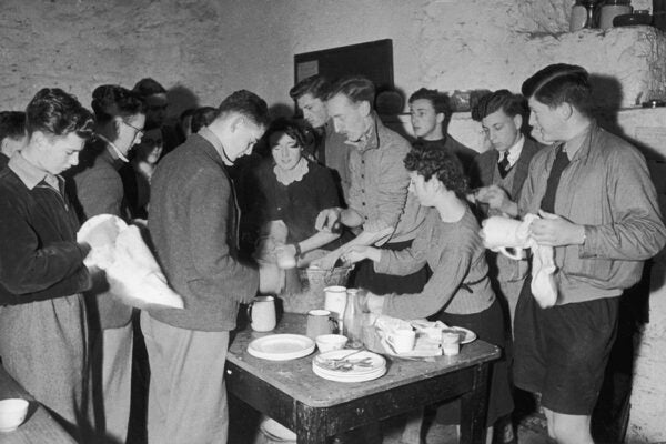 Many hands make light work of the washing up at Grasmere Youth Hostel in the Lake District, 1941