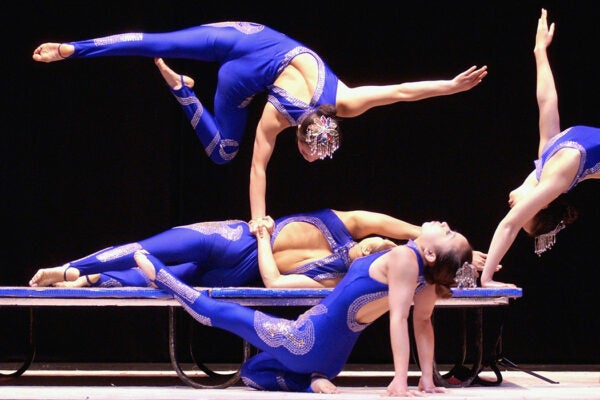 Performers go through their routine during a media call for the New Shanghai Circus Australian tour at the Lyric Theatre, Star City June 16, 2004 in Sydney, Australia.