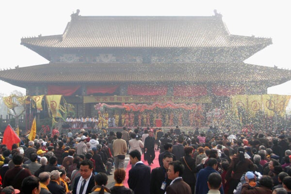 Chinese people perform Dragon Dance during a worship ceremony of Qingming Festival, also known as the "Tomb Sweeping Day" on April 2, 2005 in Chengdu of Sichuan Province, China.