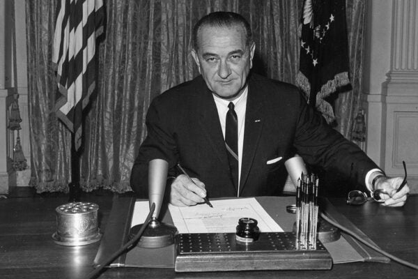 President Lyndon B. Johnson signs the Gulf of Tonkin resolution, 1964