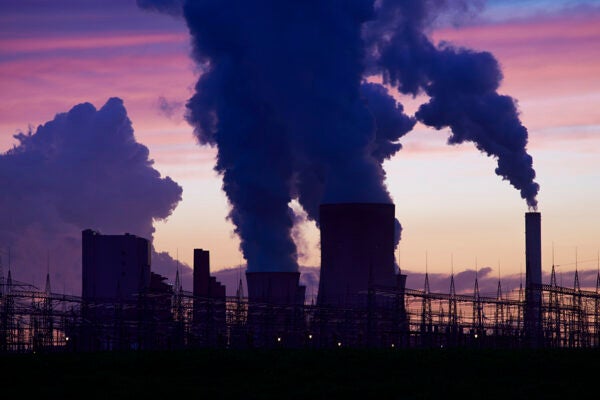 Coal burning power plant with pollution in a twilight situation.
