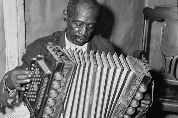 John Dyson playing the accordion, 1940