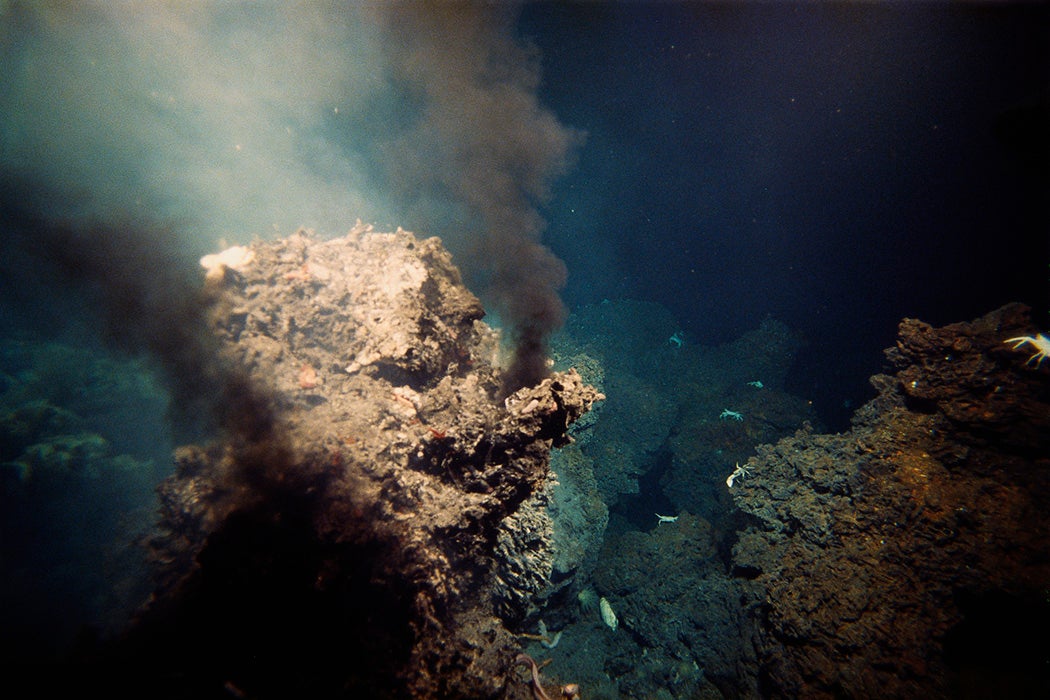 Tiny crabs and other sea life live next to a hot hydrothermal vent on the ocean's floor.