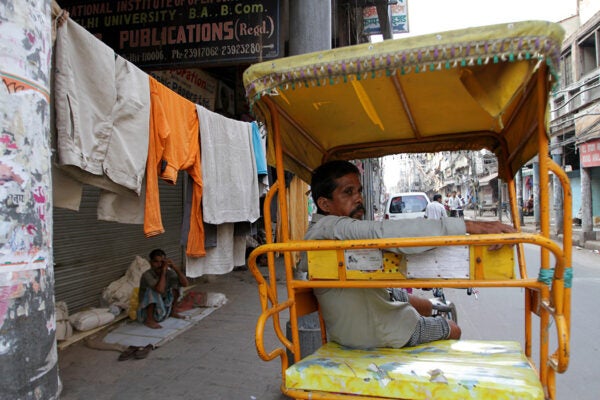 A rickshaw driver rests at the end of the day in Chandni Chowk market in the streets of Old Delhi on October 2, 2010 in Delhi, India