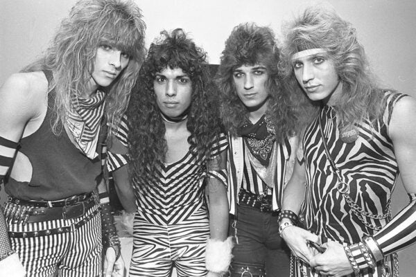 Group portrait of Christian heavy metal band Stryper, 1984