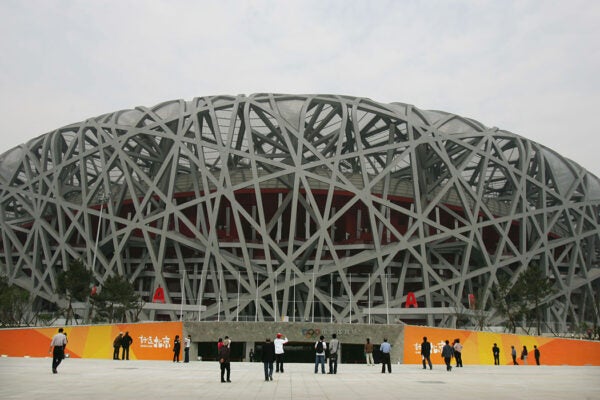 Visitors take photos of the National Stadium, dubbed the Bird's Nest on April 16, 2008 in Beijing, China.