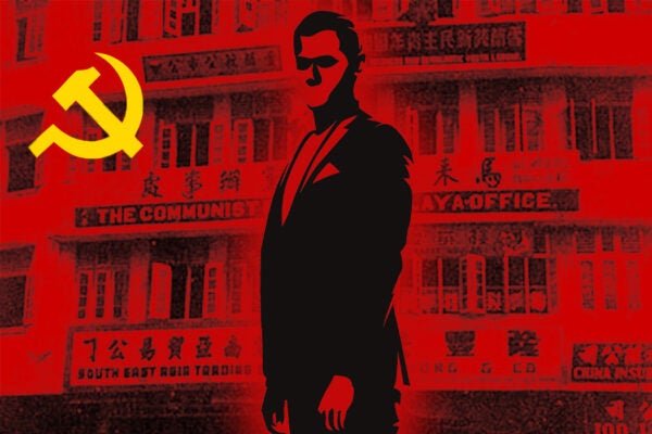 A silhouette of a spy overlaying a communist flag