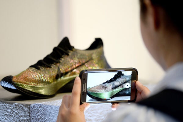 Guest taking a picture at the launch of the Nike Zoom Vaporfly Elite Flyprint in London at The Institute of Contemporary Arts on April 17, 2018