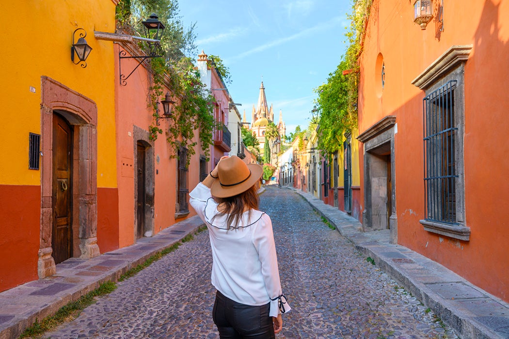 Woman admiring the parish church in San Miguel de Allende, Mexico