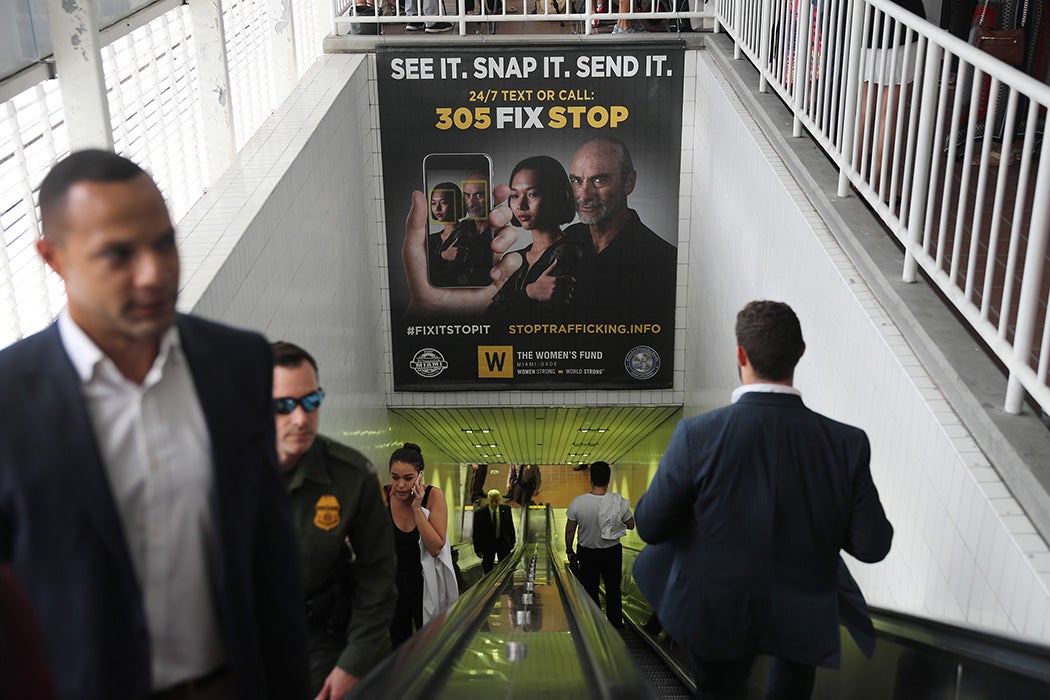 Posters urging people to report sex trafficking are seen at a metromover rail stop on November 06, 2019 in Miami, Florida.