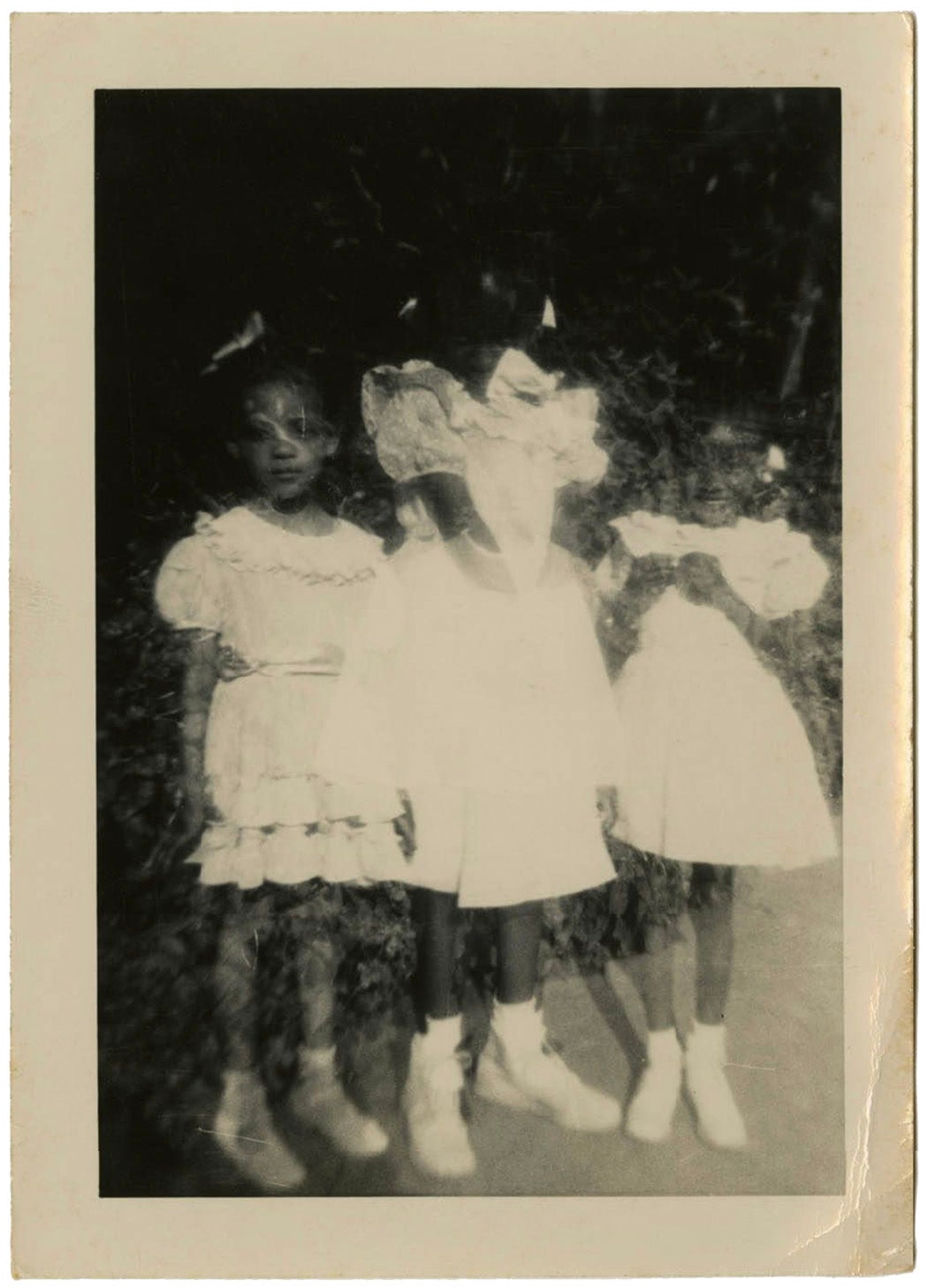 Photograph of Three Unidentified Female Children in White Dresses Posing Outdoors