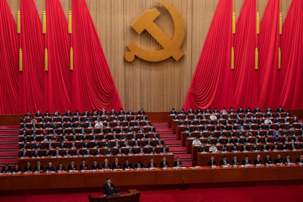 Chinese President Xi Jinping, bottom left, speaks during the Opening Ceremony of the 20th National Congress of the Communist Party of China at The Great Hall of People on October 16, 2022 in Beijing, China.