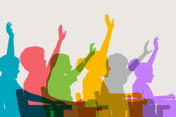Colourful overlapping silhouettes of children in classroom.